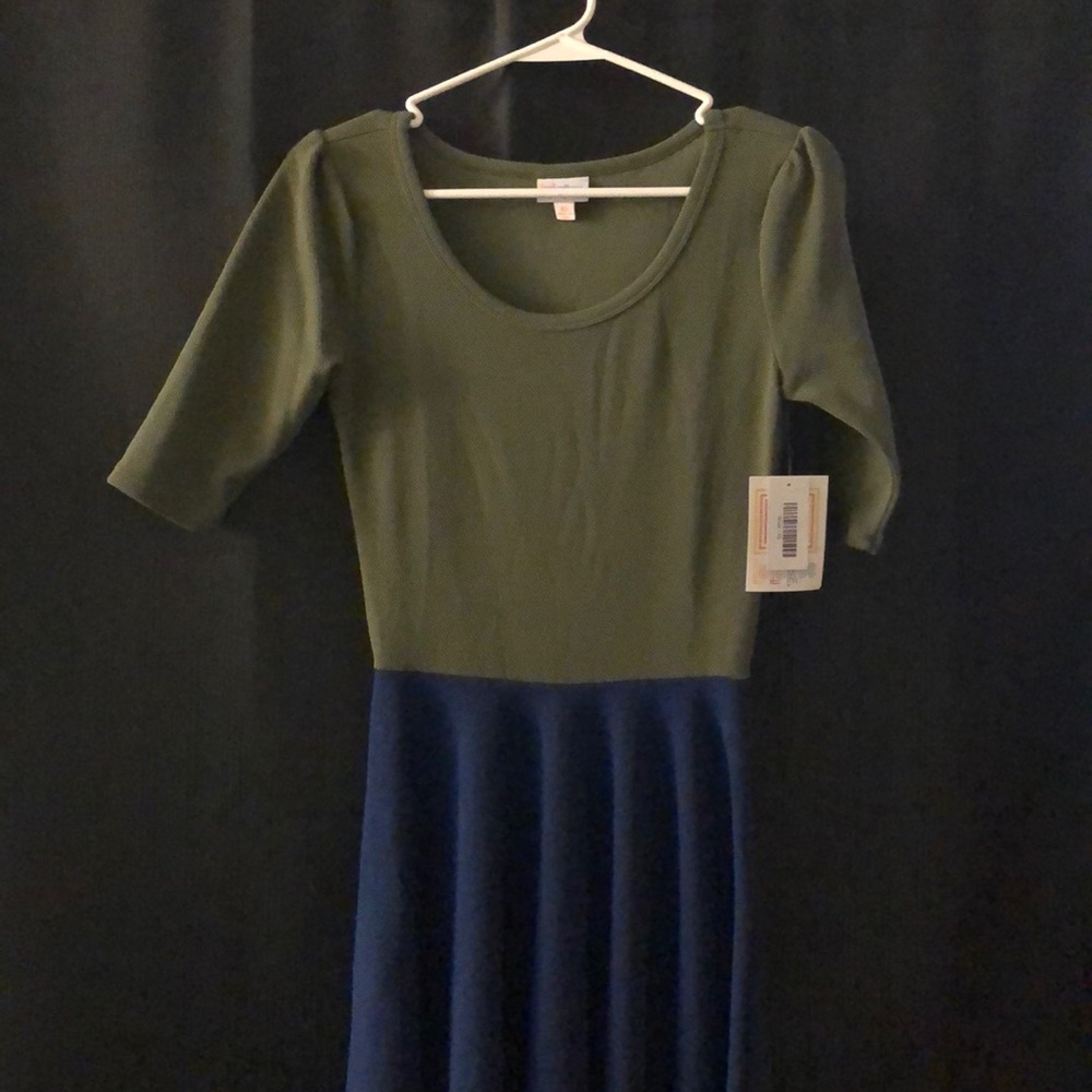 Green top & blue bottom Lularoe Nicole w/tags. XS